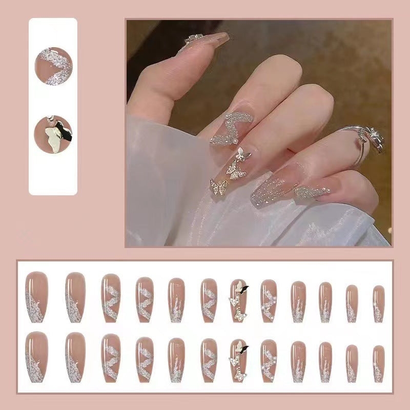 Trendy 3D design artificial nails with glitter and butterfly accents Stornfield