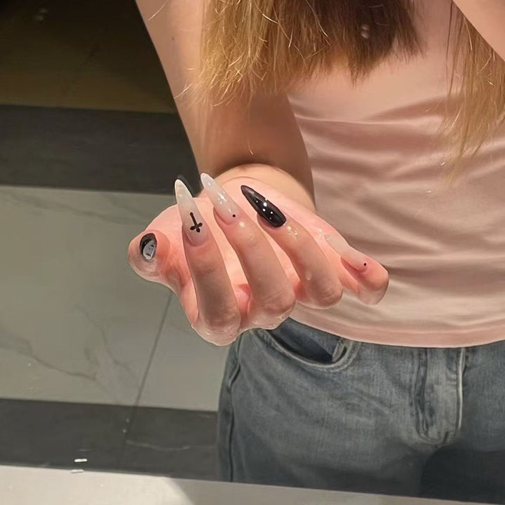 Gothic-Inspired Long Almond Nail Art Stornfield