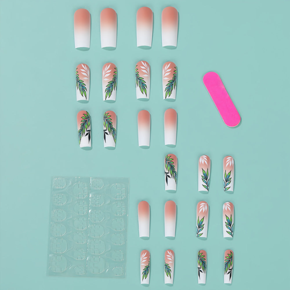 Artificial nails with elegant ombre design and floral accents Stornfield