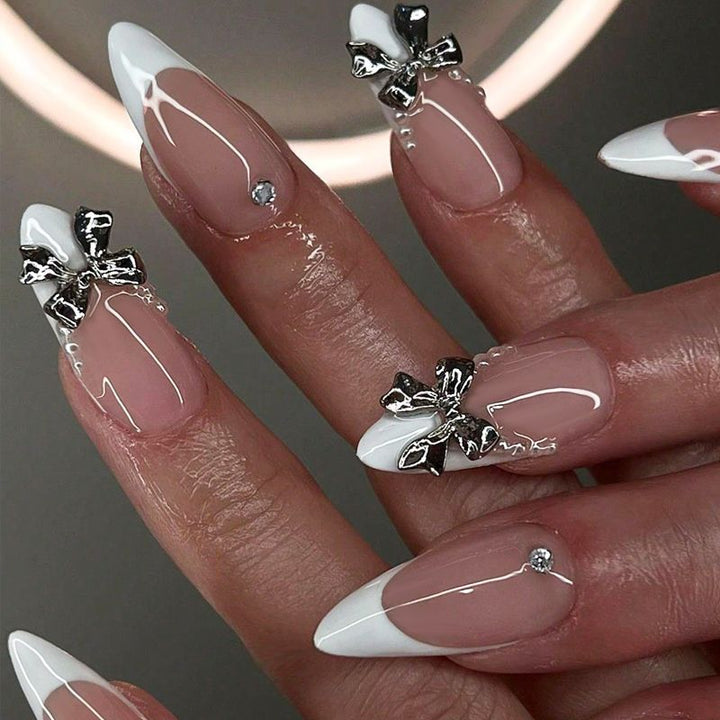 Artificial nail set with elegant French tips and decoration accents Stornfield