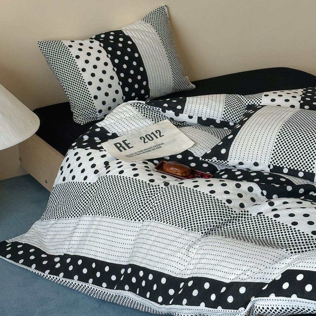 Reversible cotton percale bedding set with patched dot pattern and breathable quilted texture