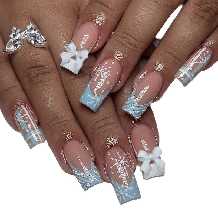 Artificial nail set with winter snowflake and bow motifs Stornfield