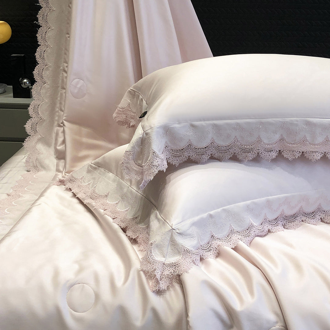 Elegant satin bedding set with lace trim and quilted bedspread