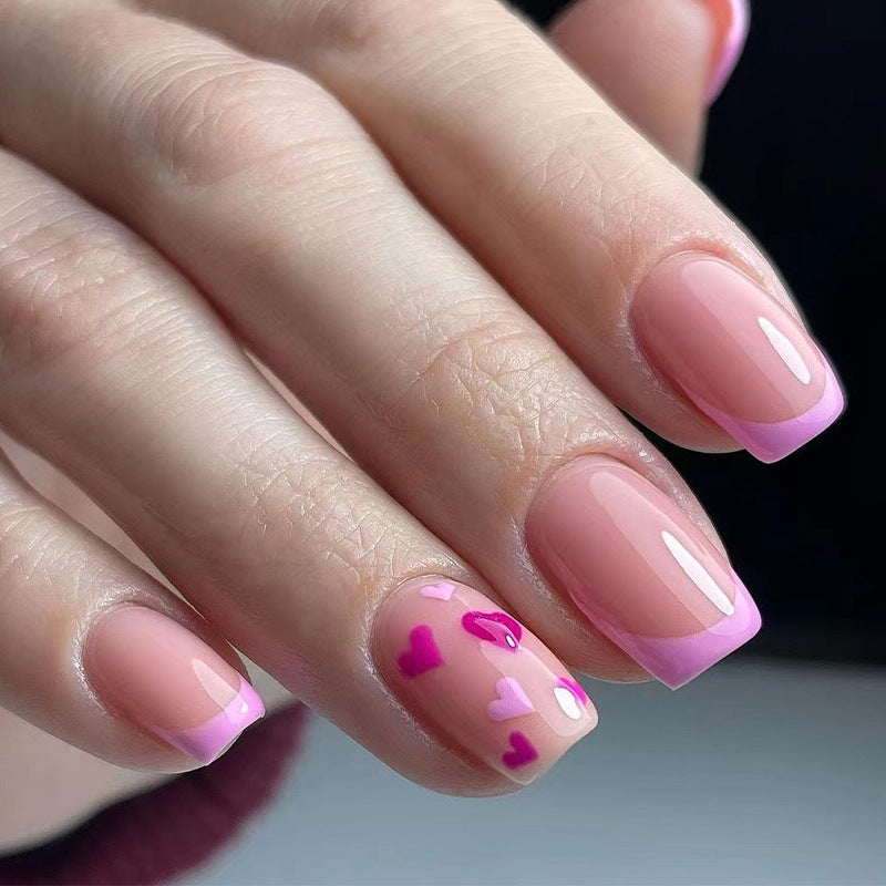 Elegant Nail Art with Heart Motifs Stornfield