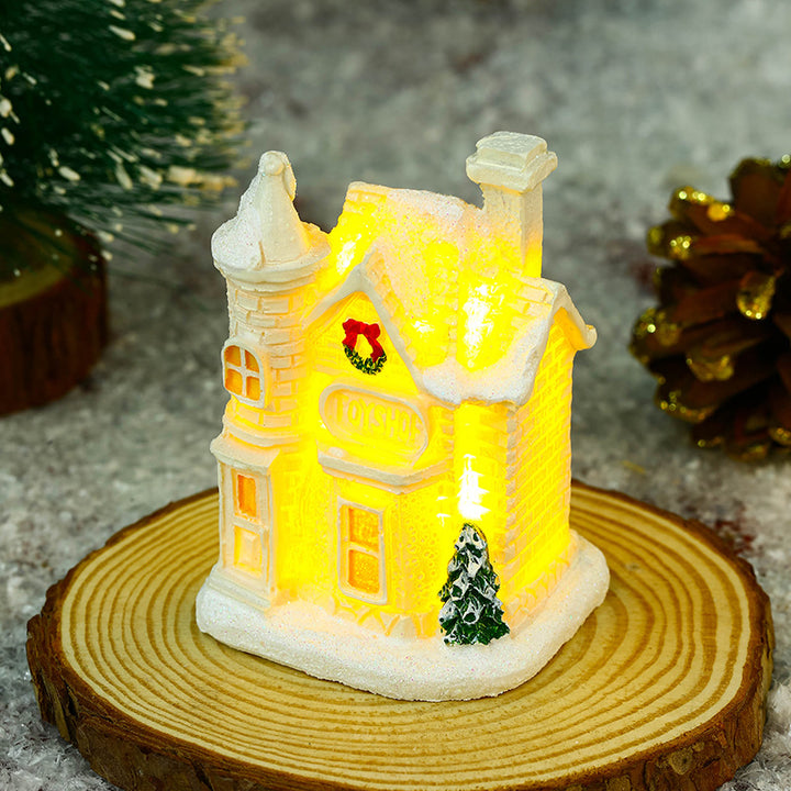 Illuminated Christmas village house with festive decoration Stornfield