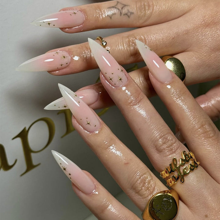 Acrylic nail set with delicate ombre design and glamorous star accents Stornfield