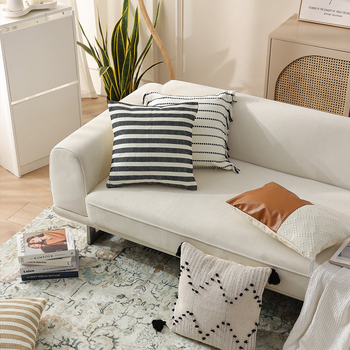 Woven square decorative cushion with fine ribbed texture and stripe pattern