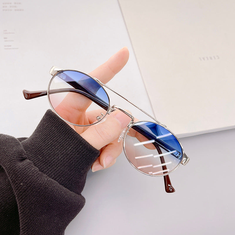 Ladies fashionable sunglasses in stylish round design with golden accents Stornfield