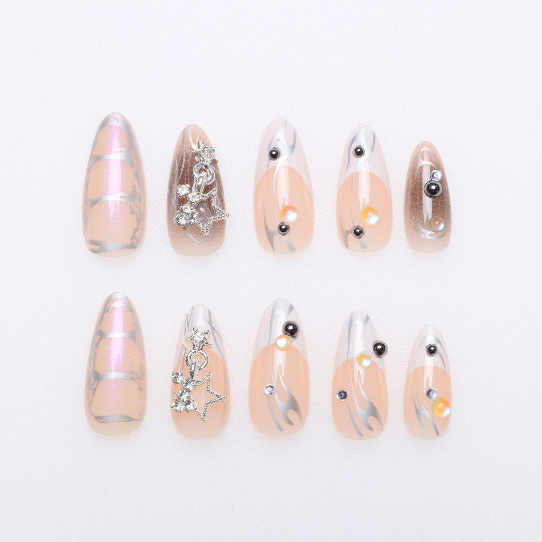 Artistic Stiletto Nail Extensions with Metallic Accents Stornfield