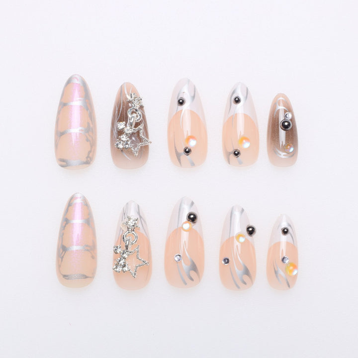 Artistic Stiletto Nail Extensions with Metallic Accents Stornfield