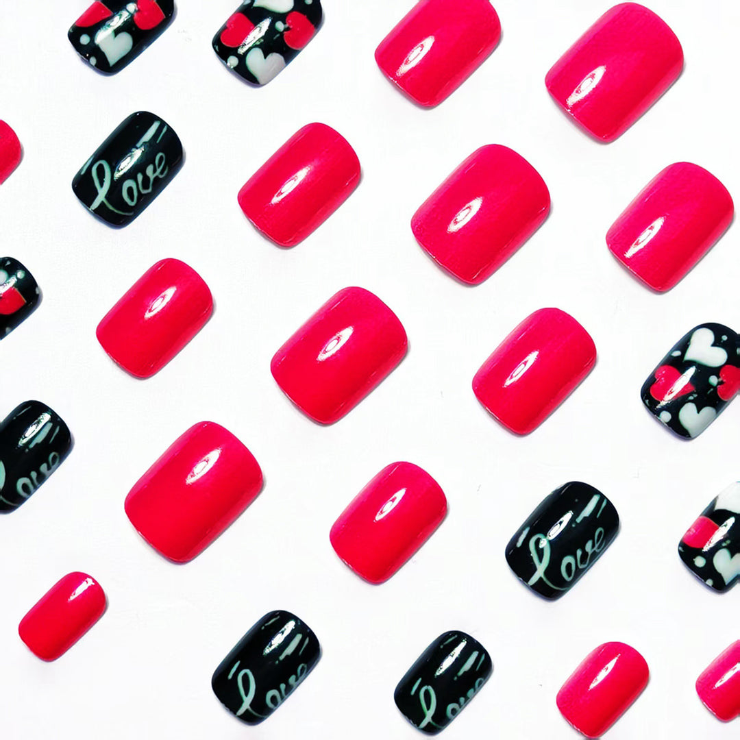 Acrylic nail design with hearts and kiss motifs Stornfield