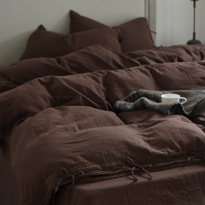 Natural linen bedding set with decorative ties and stonewashed texture