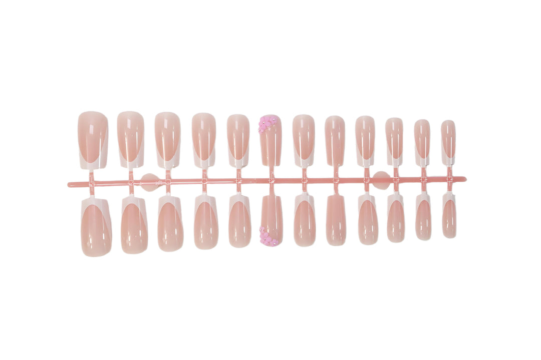 Acrylic nail set with elegant French tips and decorative accents Stornfield