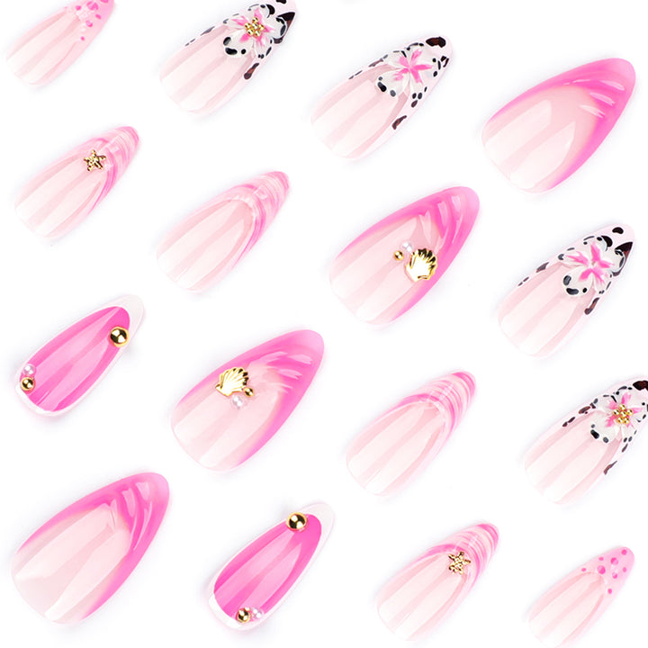 Artistic nail extensions with floral accents and glitter Stornfield