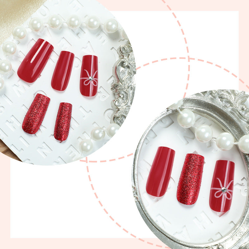 Creative acrylic nail set with glitter and bow designs Stornfield