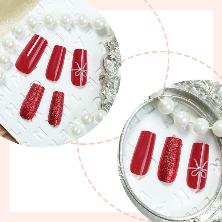 Creative acrylic nail set with glitter and bow designs Stornfield