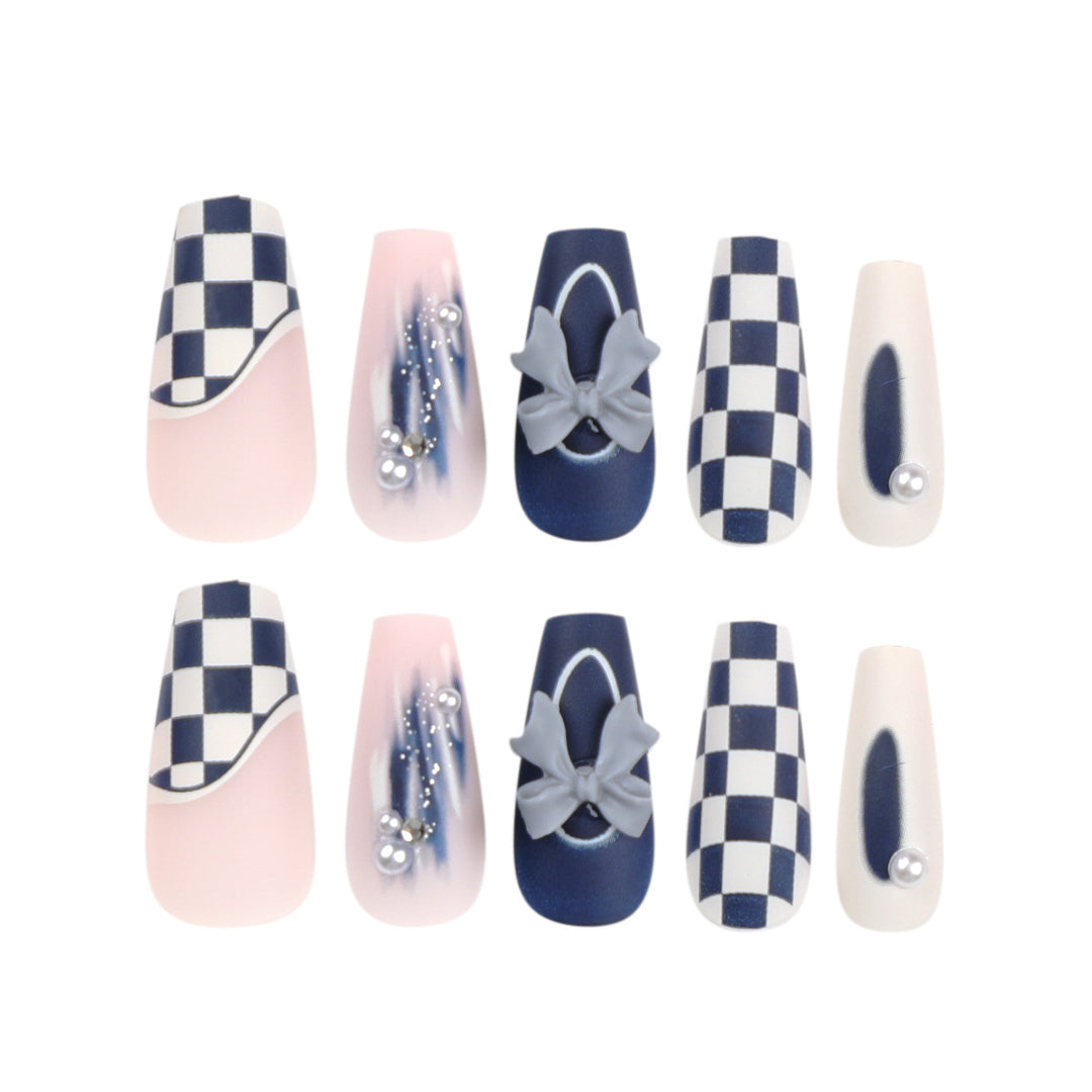 Artful nail decoration with bows and plaid pattern Stornfield