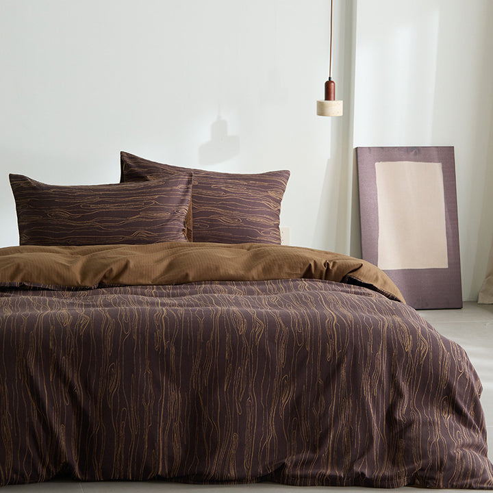 Modern bedding set made of cotton percale with organic stain pattern