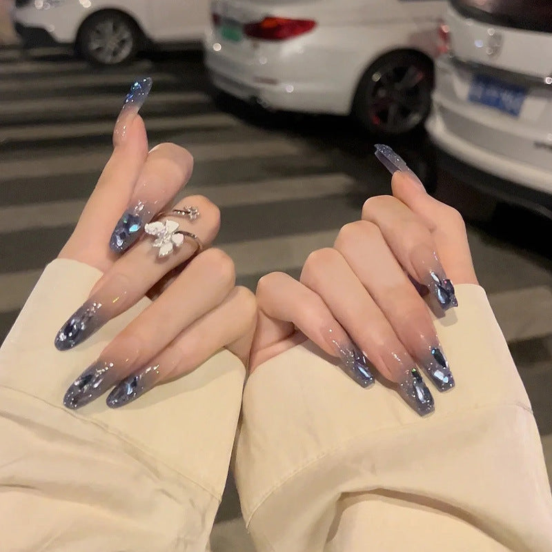Glamorous artificial nails with heart-shaped accents Stornfield
