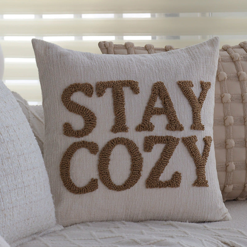 Square decorative cushion cover made of mottled bouclé weave with subtle piping Stornfield