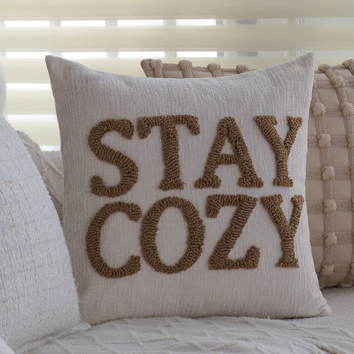 Square decorative cushion cover made of mottled bouclé weave with subtle piping Stornfield