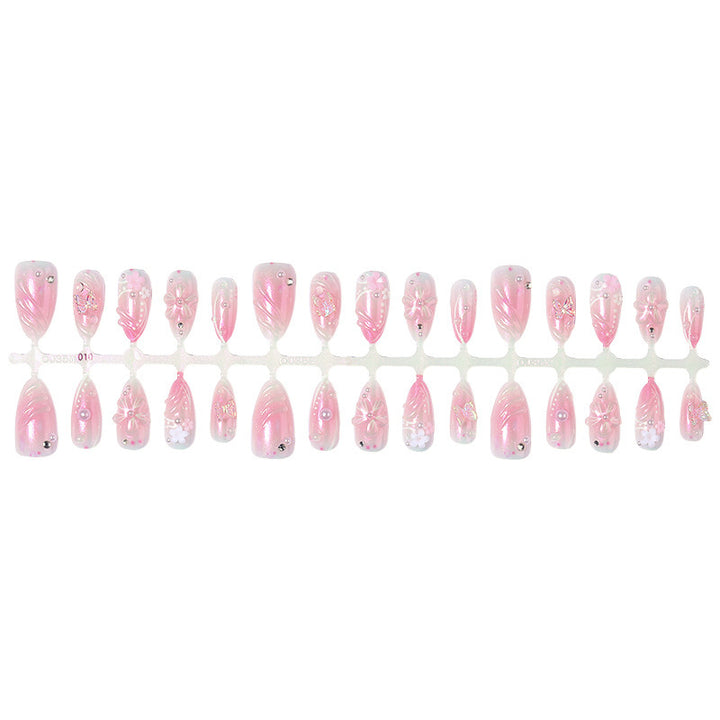 Artificial nail set with sparkling glitter and floral accents Stornfield