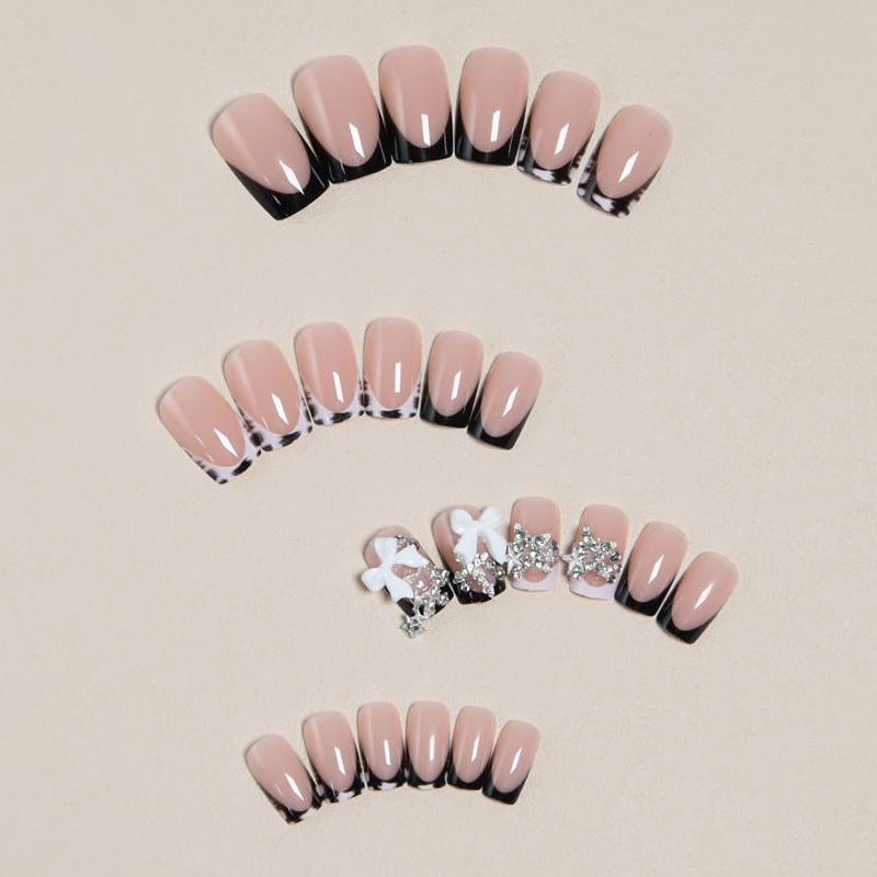 Elegant artificial nails with detailed embellishments Stornfield