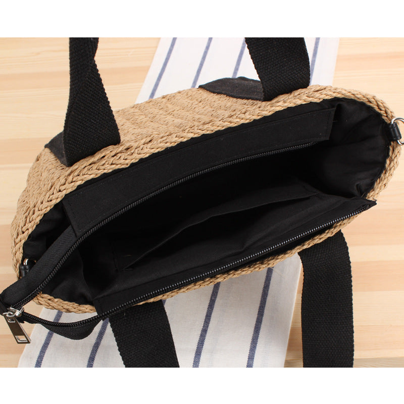 Handbag made of braided natural material with adjustable shoulder strap Stornfield
