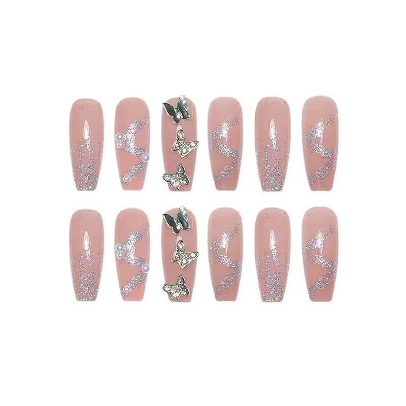 Trendy 3D design artificial nails with glitter and butterfly accents Stornfield