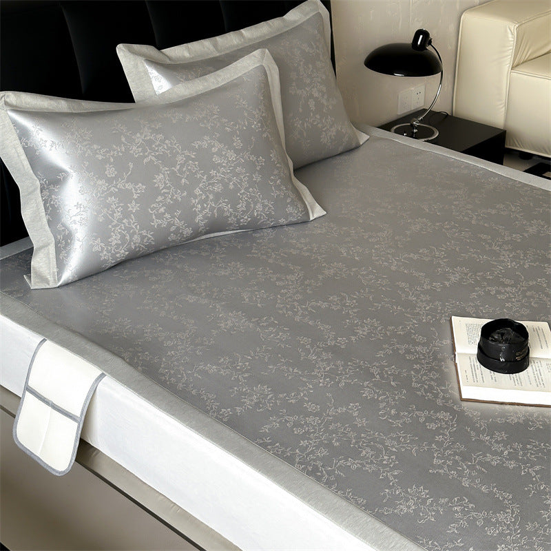 Finely woven satin fitted sheet with floral jacquard relief and reinforced all-round elastic