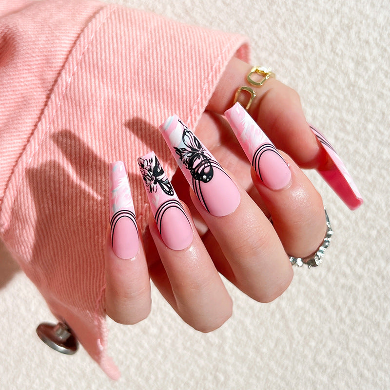 Artificial nail art with delicate butterfly designs Stornfield