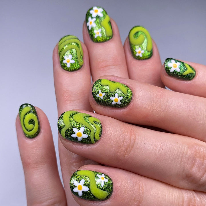 Artificial nails with floral and glittering accents Stornfield