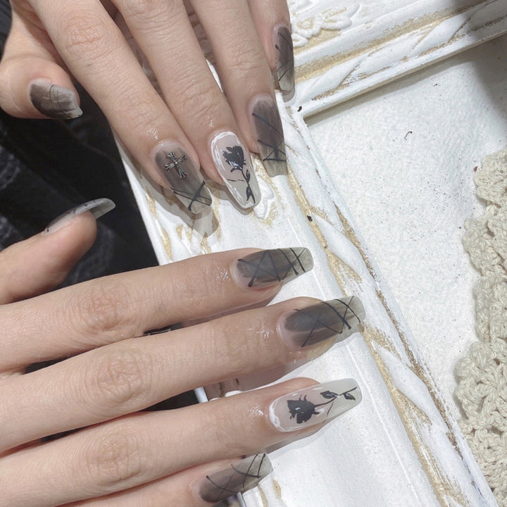 Artful stiletto nails with floral accents Stornfield