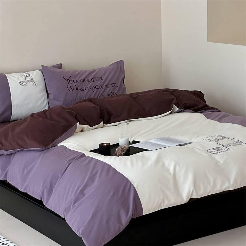 Reversible bedding set with contrasting inserts and fine line embroidery