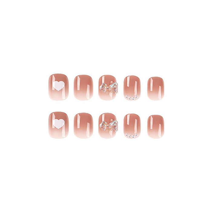 Artificial nails with romantic hearts and glitter accents Stornfield