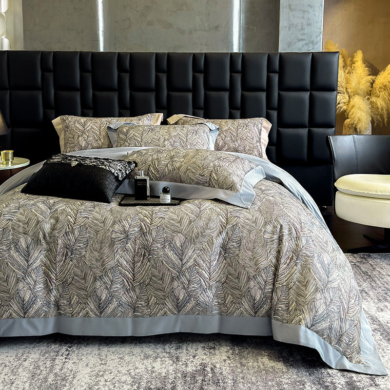 Elegant bed linen set made of cotton satin with a subtle leaf pattern and contrast piping