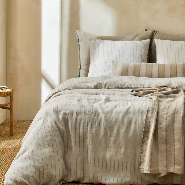 Linen bedding set with fine pinstripes and reversible function