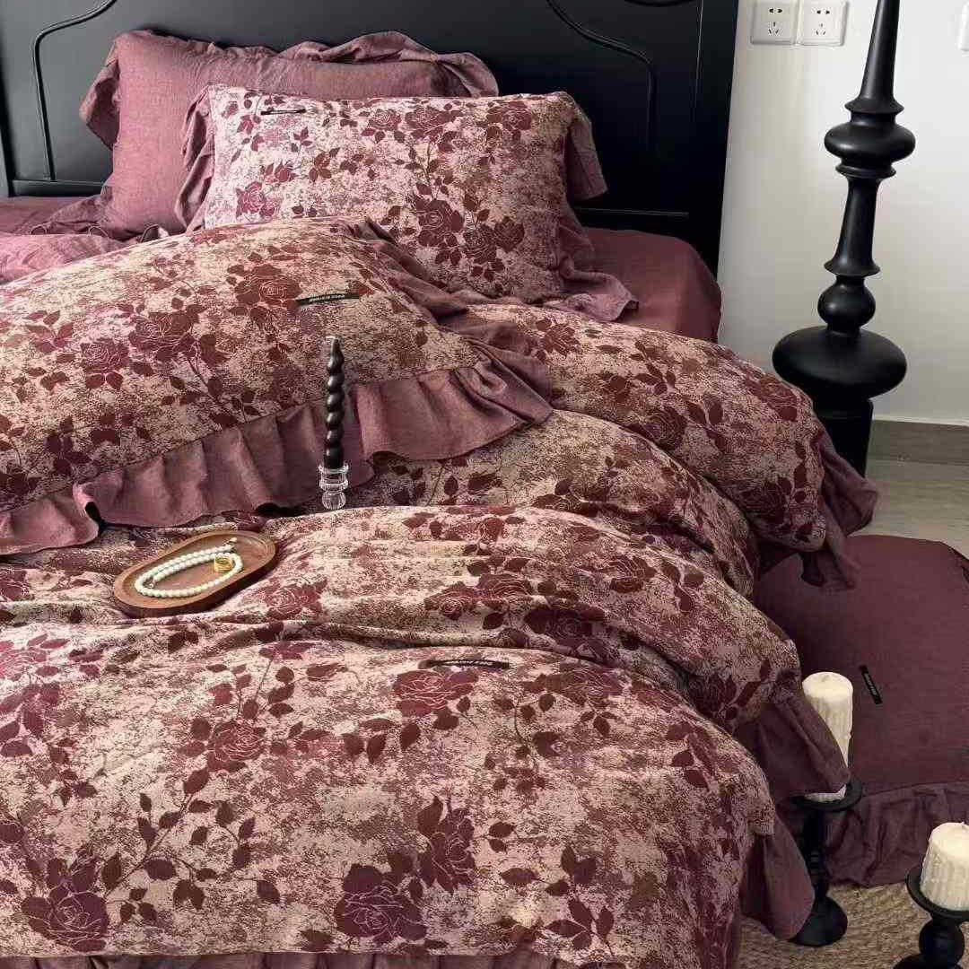 Quilted bed set in vintage look made from cotton blend with velvety floral pattern appearance and ruffle