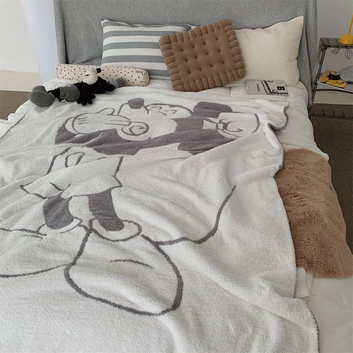 Cozy bedspread made of microfiber with a large woven cartoon motif