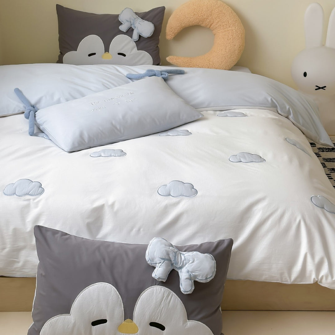 Children's bedding set with embroidered sprinkle appliqués, cuddle pillow and reversible function