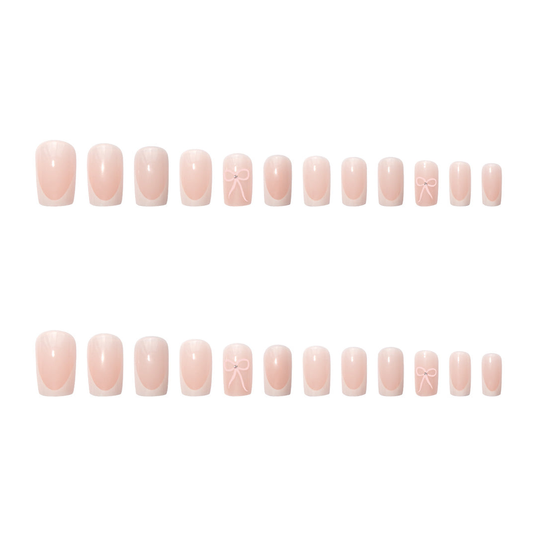 Nail art set with elegant bow and glitter accents Stornfield