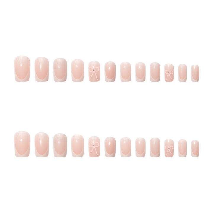 Nail art set with elegant bow and glitter accents Stornfield
