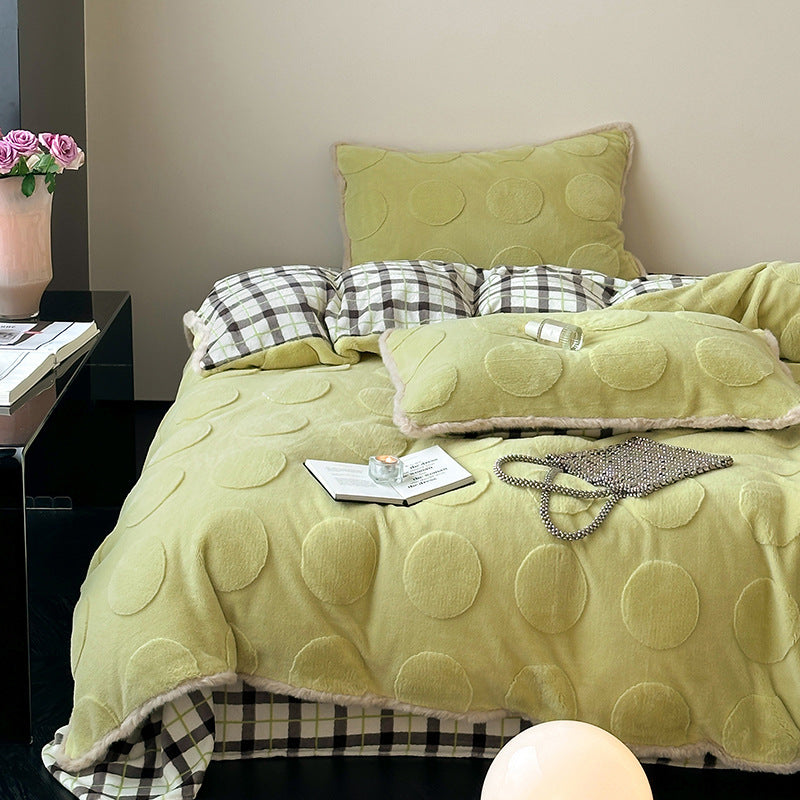 Plush bedding set with embossed floral relief and teddy trim