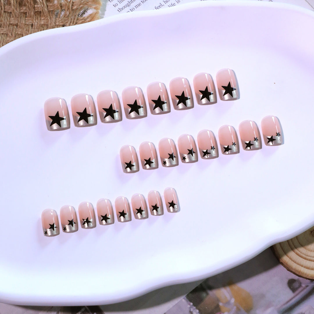 Sparkling nail art with stars and glitter accents Stornfield