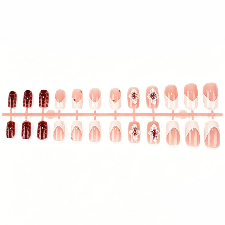 Artificial nail set with luxurious 3D flower accents and glitter details Stornfield