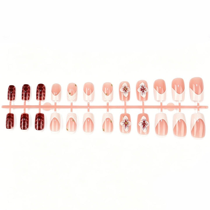 Artificial nail set with luxurious 3D flower accents and glitter details Stornfield