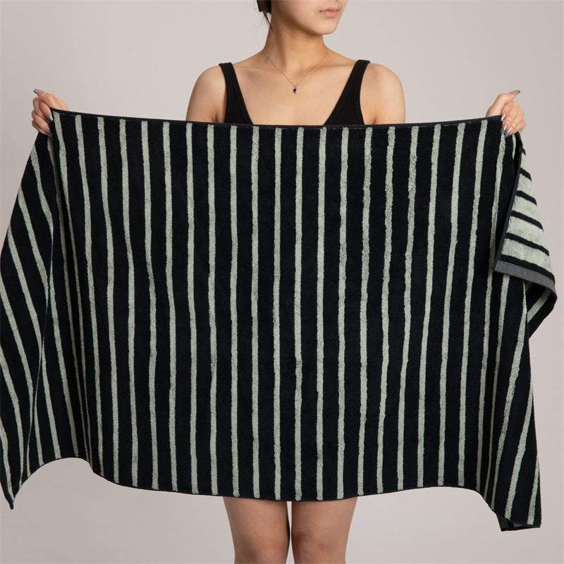 Large cotton terry towel with striped pattern and high absorbency