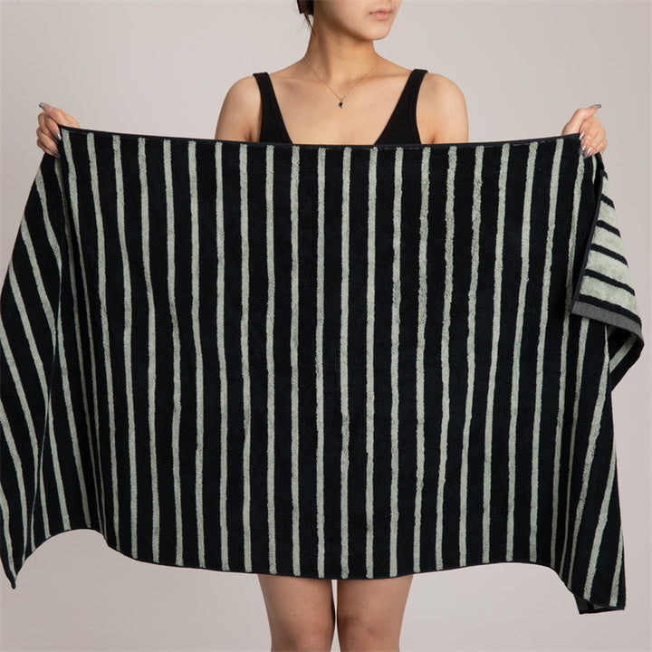 Large cotton terry towel with striped pattern and high absorbency