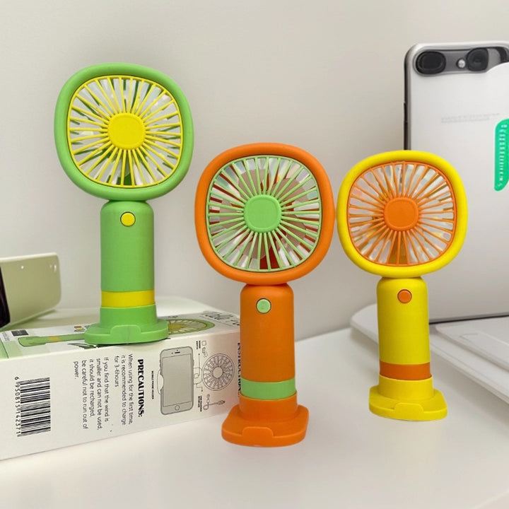 Unisex Handheld Fan with ergonomic design and practical stand function Stornfield