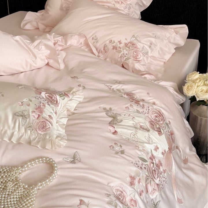 Romantic satin bed linen set with richly embroidered rose border and frill
